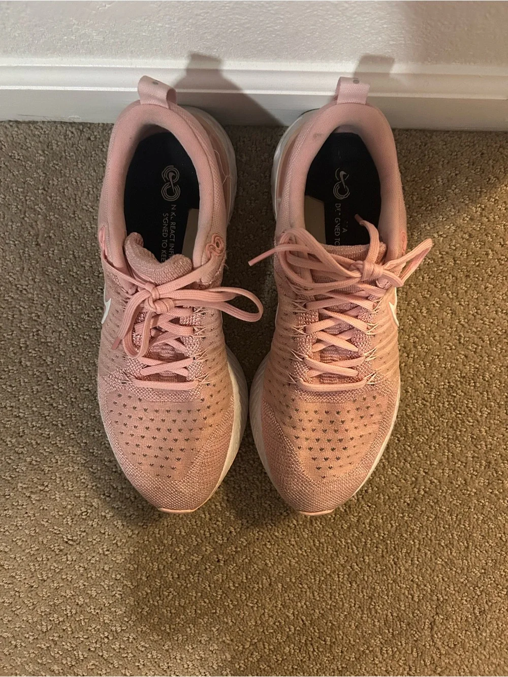 Nike Women's React Infinity Run Flyknit 2 Running Shoes in Pink Glaze